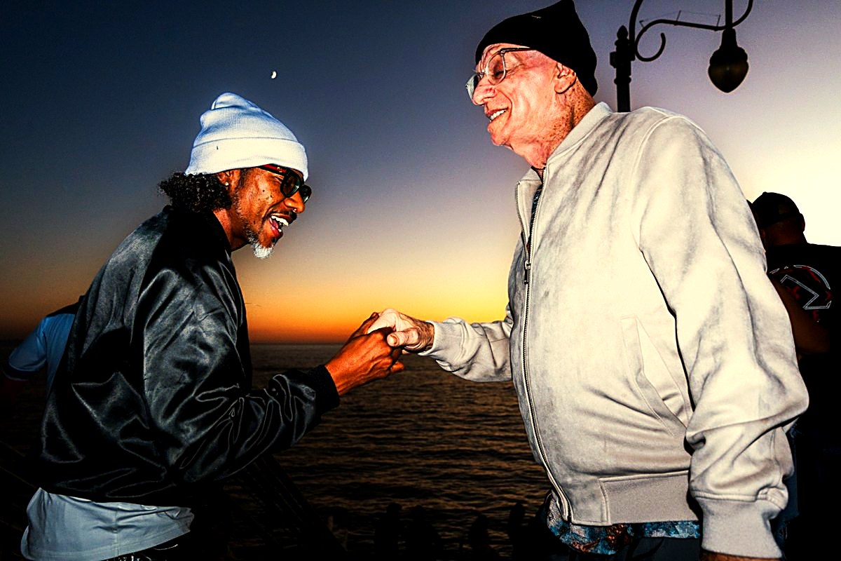 Fist-bump photo at sunset graded with the Golden Hour preset